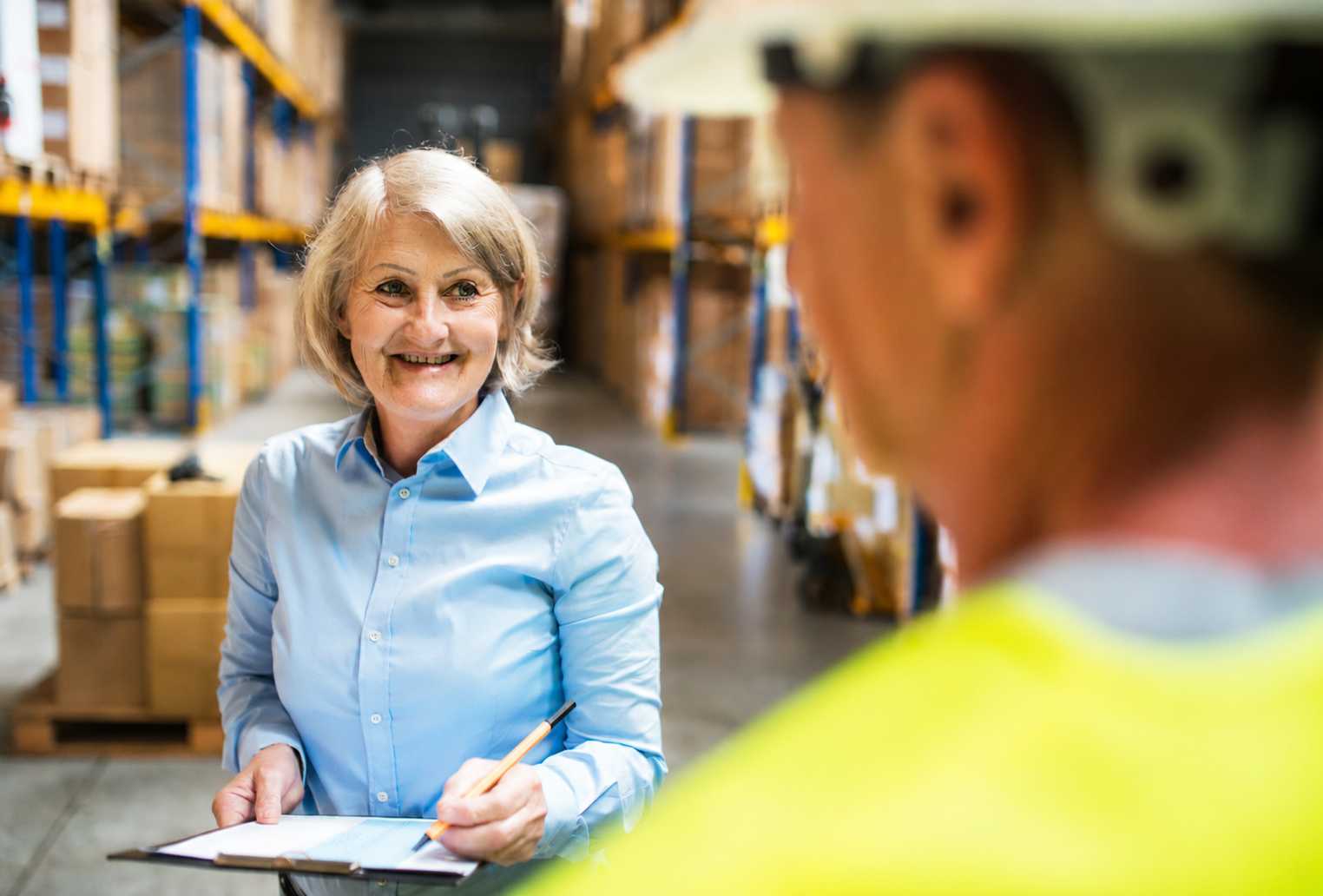 woman talking to a man in a warehouse
