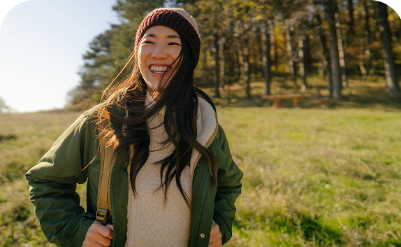 woman in the countryside smiling